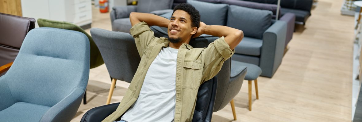 young-man-choosing-chair-in-furniture-store-2022-02-18-04-33-13-utc_Easy-Resize.com_.jpg